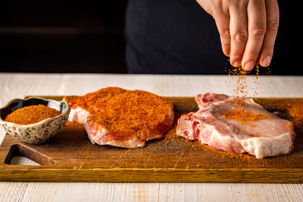 Applying seasoning on pork chops:  for best pork chop seasoning