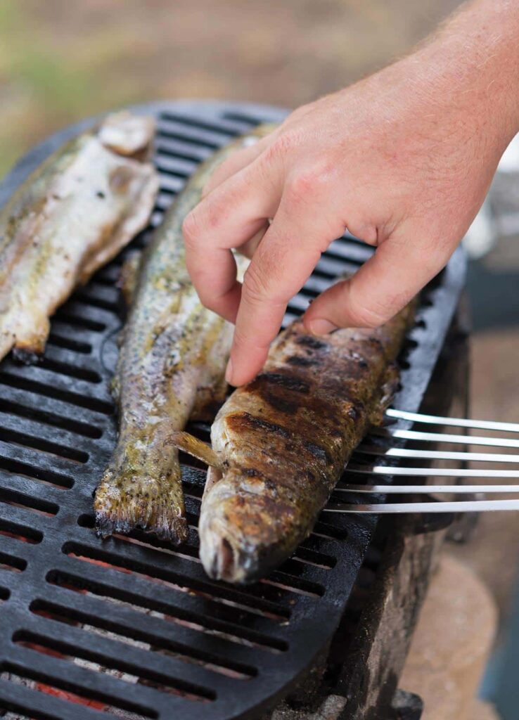 How to Cook Sea Bass in a BBQ: flipping seabass on the grill
