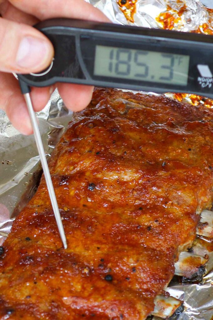 How long should ribs be cooked in the oven without