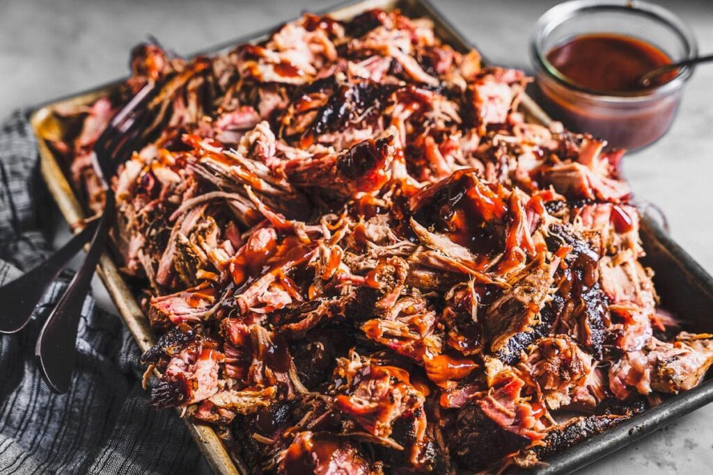 BBQ Pulled Pork Recipes Slow Cooker with bbq sauce on top
