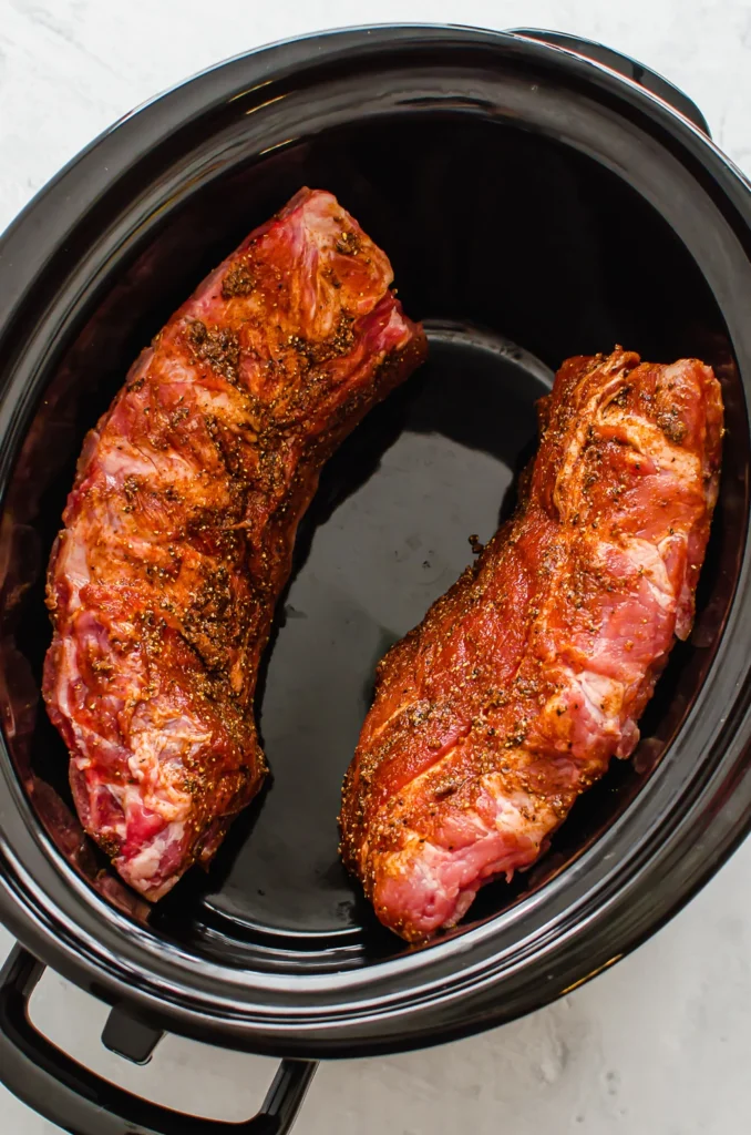 Place the ribs in the slow cooker