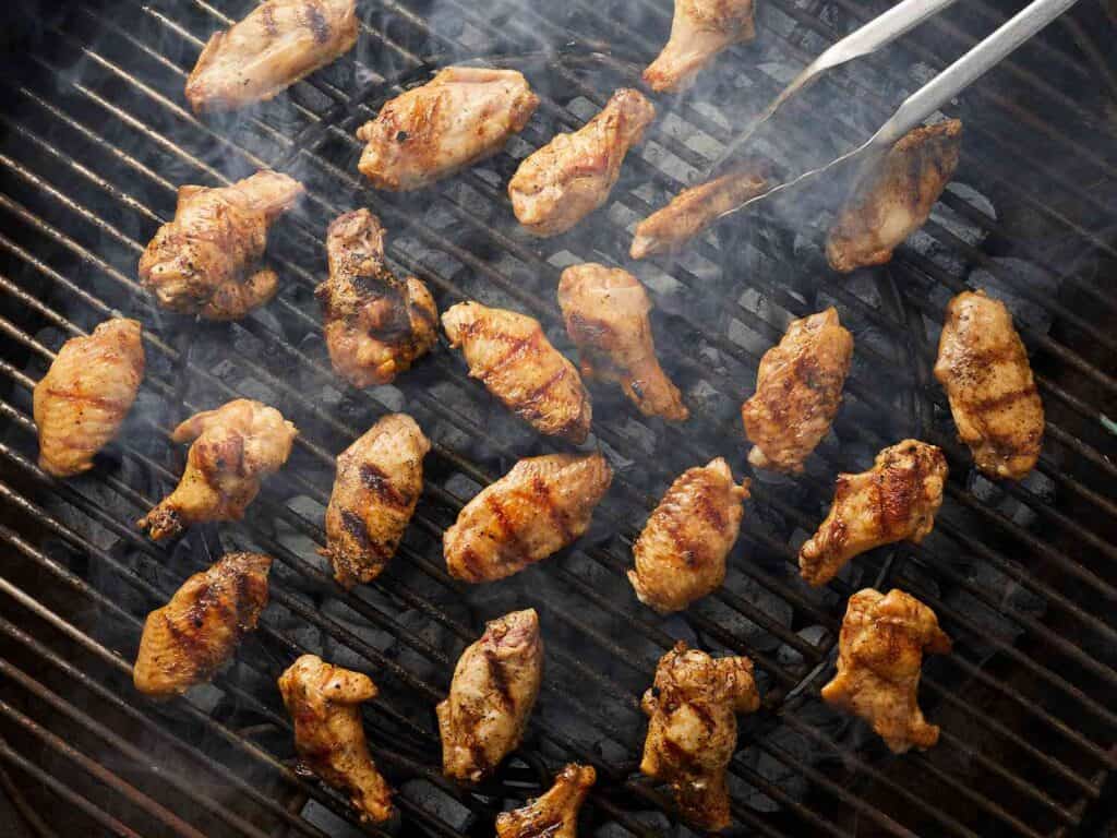 Step-by-step guide to Grilling Chicken Wings and Legs on a charcoal grill