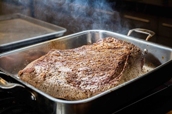 Slow-roasted brisket with a wood-smoked flavor in the oven