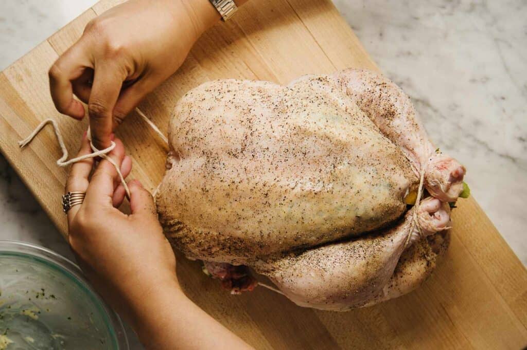 Proper method for barbecuing a smoked turkey: Trussing helps