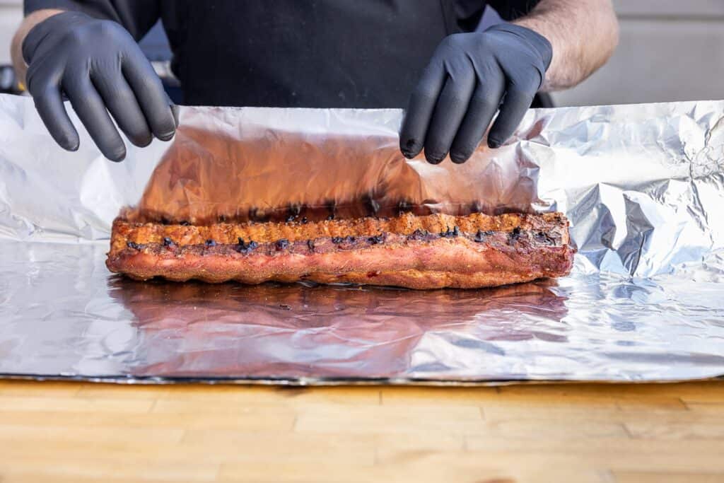 After three hours, it’s time to wrap the ribs.