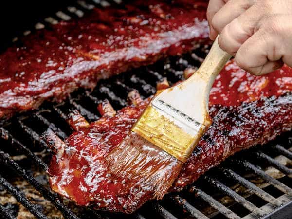 Finishing Touches for BBQ Beef Ribs: Applying BBQ sauce to your beef ribs